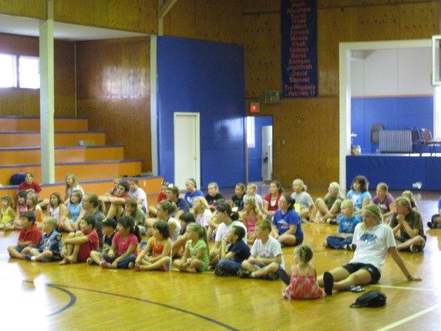 camp group open listening in the gym